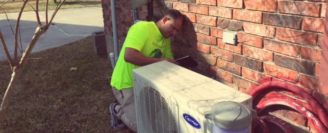 HVAC technician working on a mini-split HVAC system