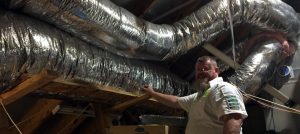 Rob inspecting duct work in attic