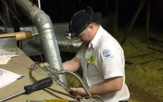 Kenny working on an air handler in the attic
