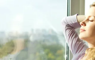 HVAC maintenance is on autopilot. Now, a woman is relaxing and comfortable at home