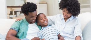 Happy African-American family comfortable in their home