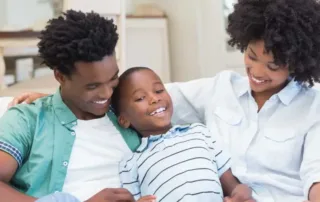 Happy African-American family comfortable in their home