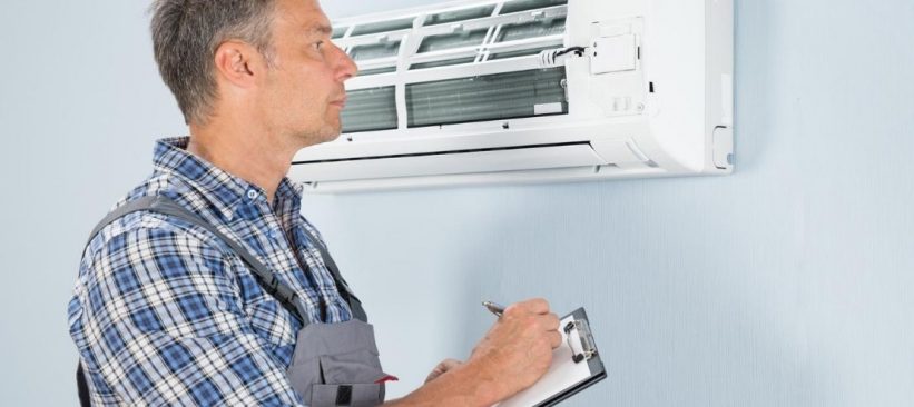 HVAC technician with an HVAC inspection checklist