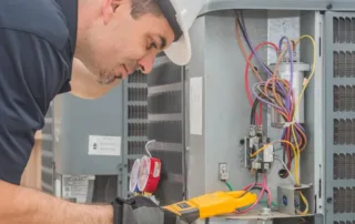 licensed hvac technician giving an HVAC tune-up