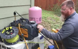HVAC tech Rob Terry conducting an AC tune-up