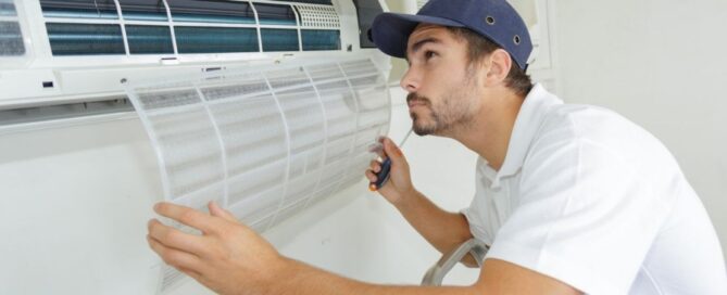 HVAC technician conducts hvac maintenance on a mini split HVAC system