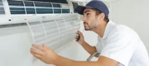 HVAC technician conducts hvac maintenance on a mini split HVAC system