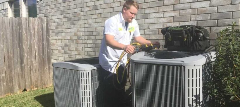 AC-technician-performing-HVAC-maintenance