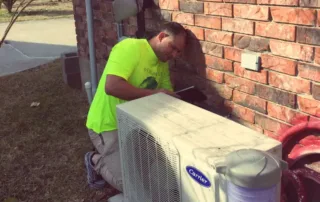 HVAC technician working on a mini-split HVAC system