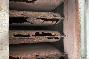 you may need to replace a furnace if your heat exchanger is cracked and rusted through like this one