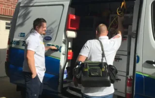 Kenny and Rob of Terry's A/C and Heating getting tools out of the truck