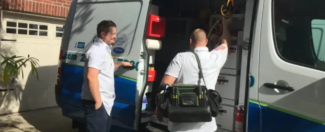 Kenny and Rob of Terry's A/C and Heating getting tools out of the truck